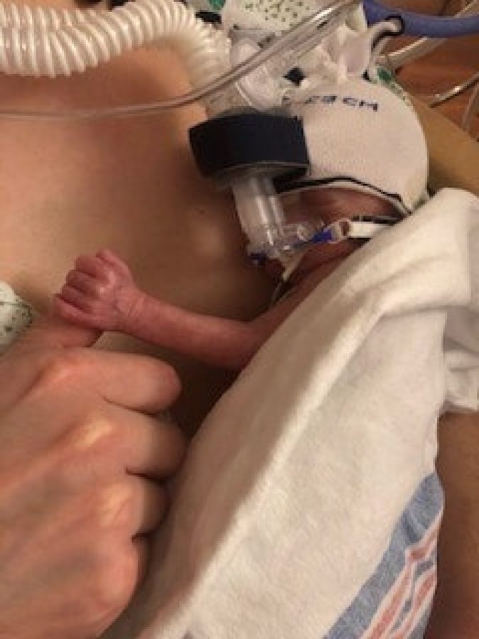 Caroline's mother holding her shortly after she was born