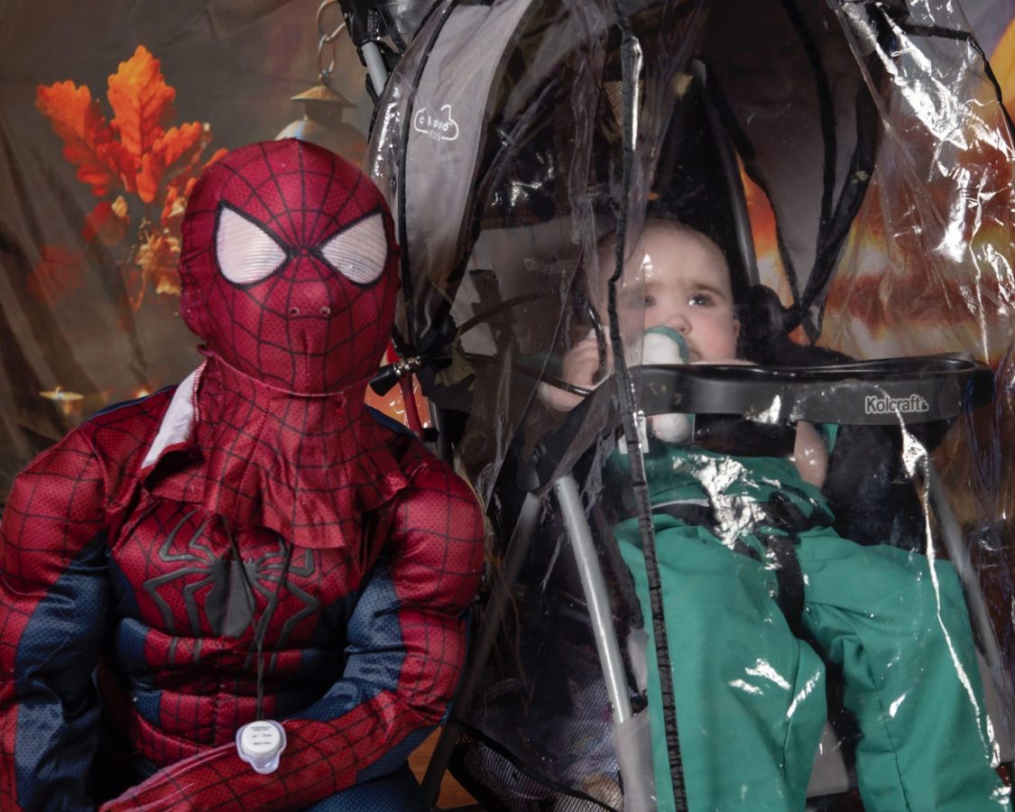 Image from Halloween in our House - Picture with a kid in a Spiderman costume and a baby