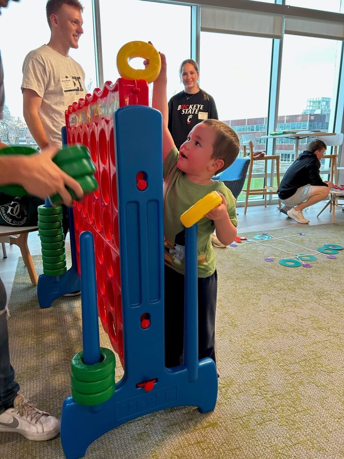 Image from Programs they love - Boy playing 4 in a row game
