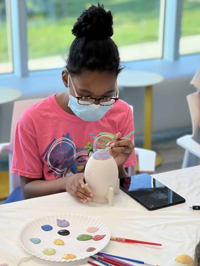 Image from Moments of Joy - Girl painting a rocket