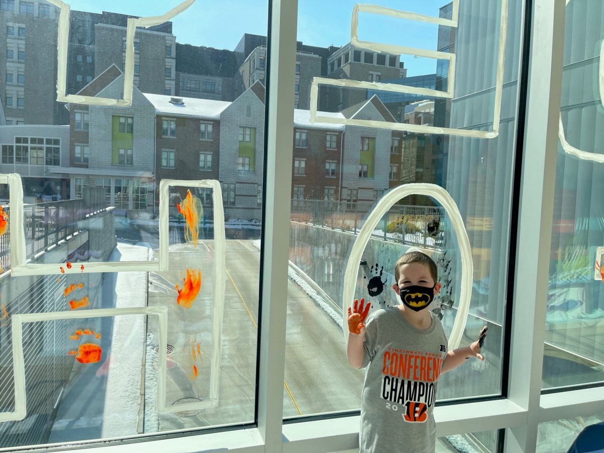 Image from Who Dey - Little boy posing in the hallway