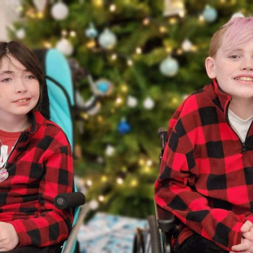 Two children wearing flannel for Christmas