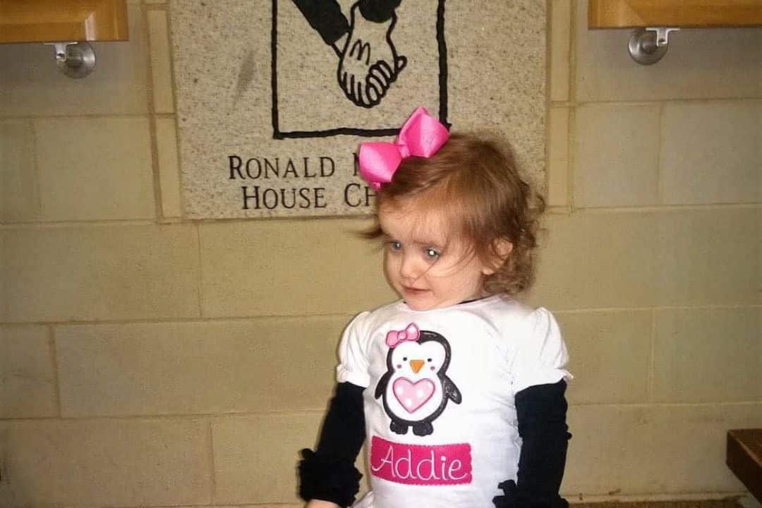 Young Addie in her penguin shirt with her name on it.