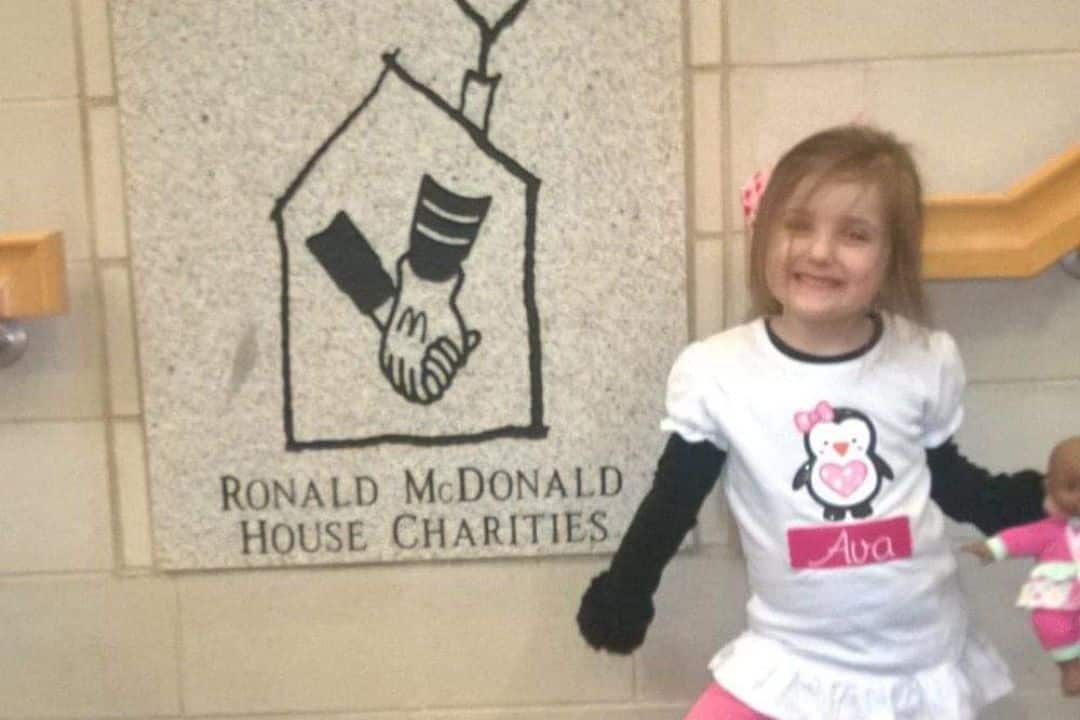 Young Ava in her penguin shirt with her name on it.